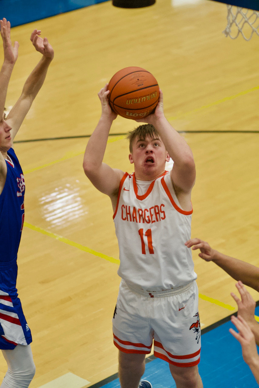Ross Dyson shoots a shot from the post during North Montgomery's 57-31 loss to Western Boone in the consolation game of the 15th annual Boys Sugar Creek Classic.